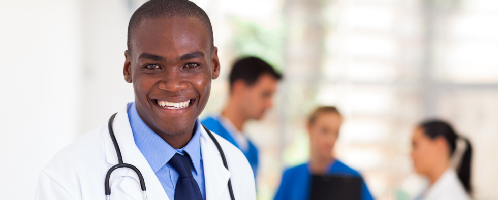 male black american doctor with nurse in the background